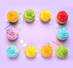 Photo of Colorful birthday cupcakes on lilac background, flat lay. Space for text