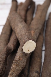 Photo of Raw salsify roots on table, closeup view