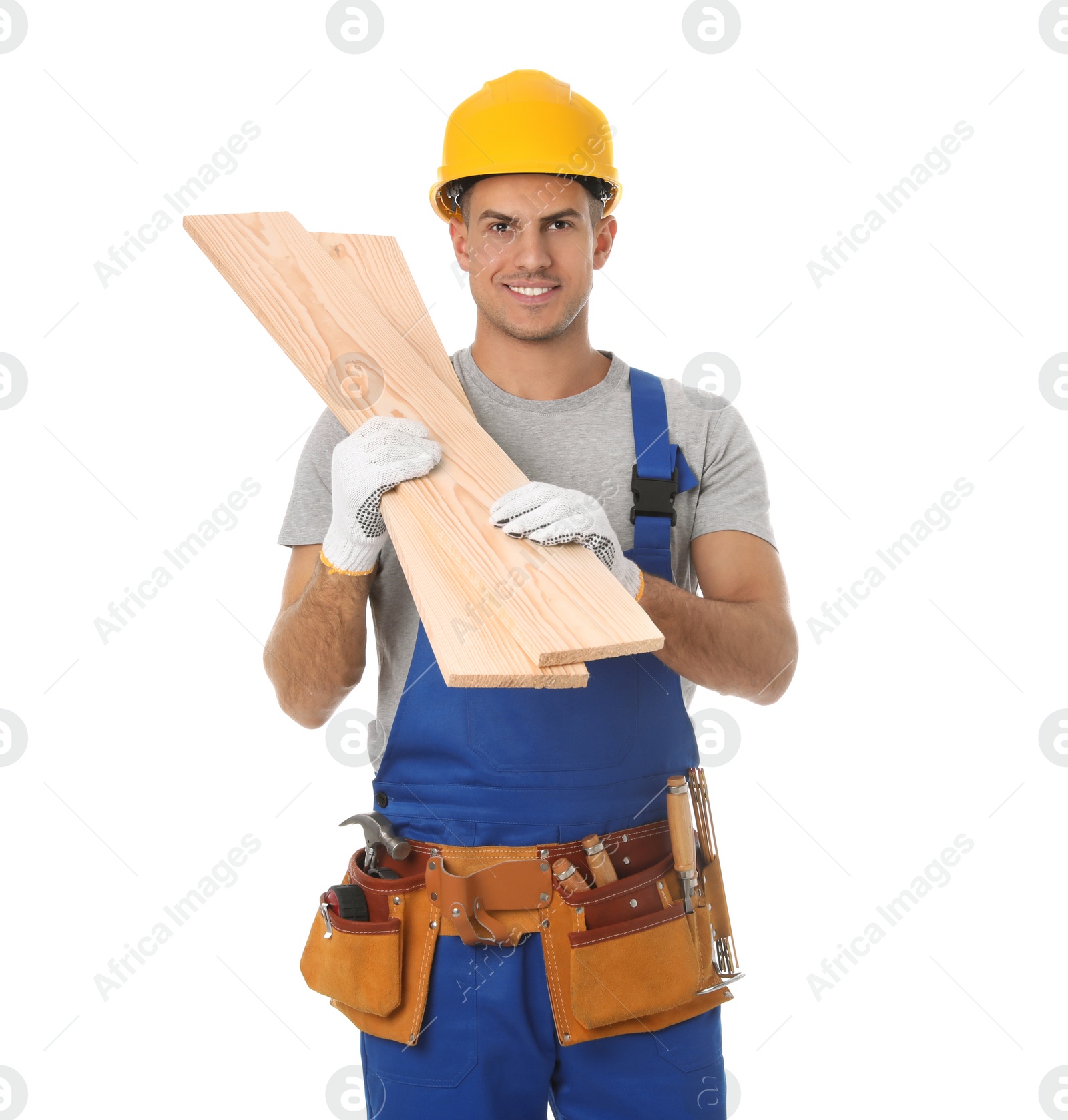 Photo of Handsome carpenter with wooden planks isolated on white