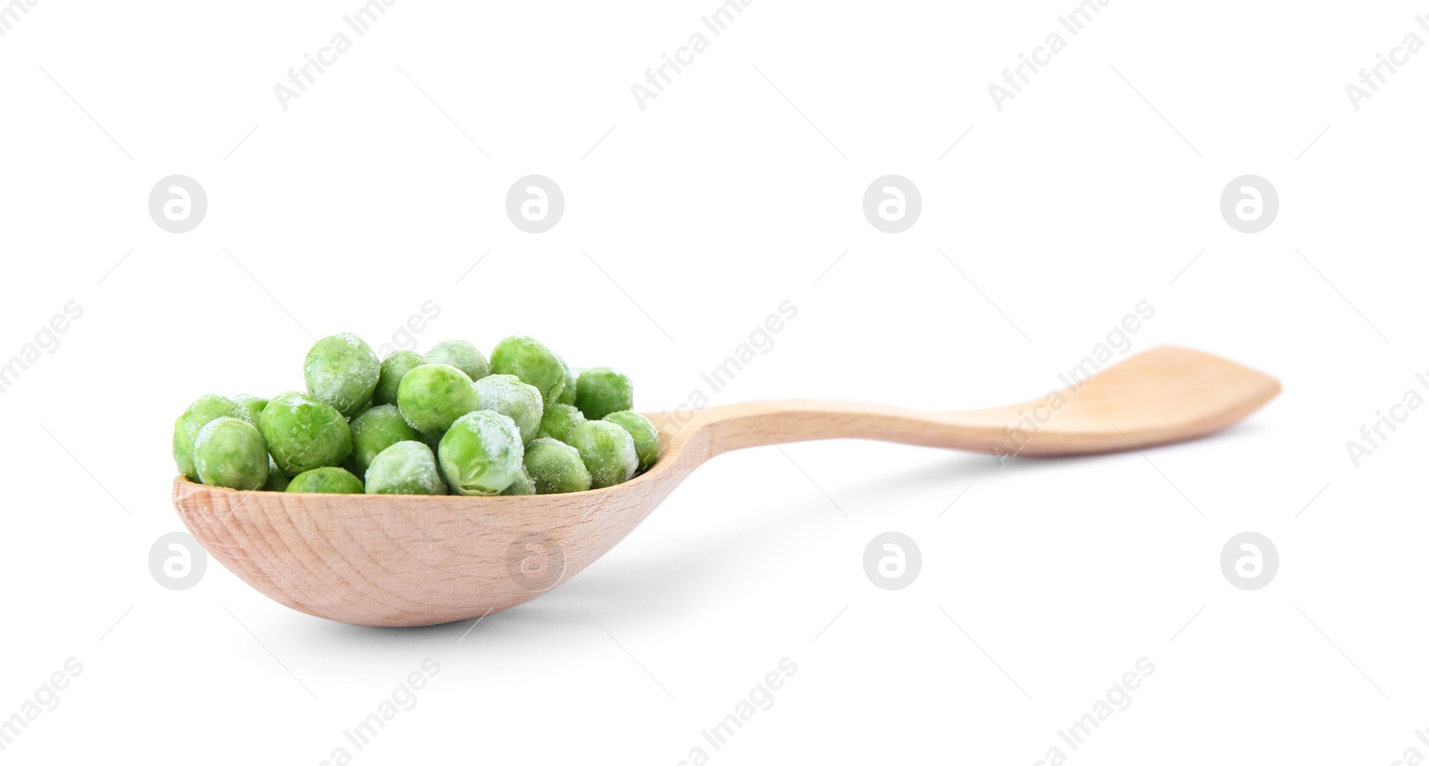 Photo of Spoon with frozen peas on white background. Vegetable preservation
