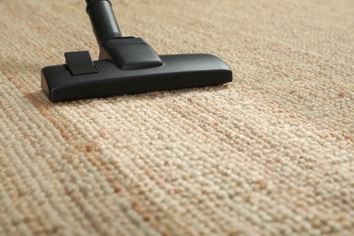 Image of Hoovering carpet with vacuum cleaner, closeup. Clean trace on dirty surface