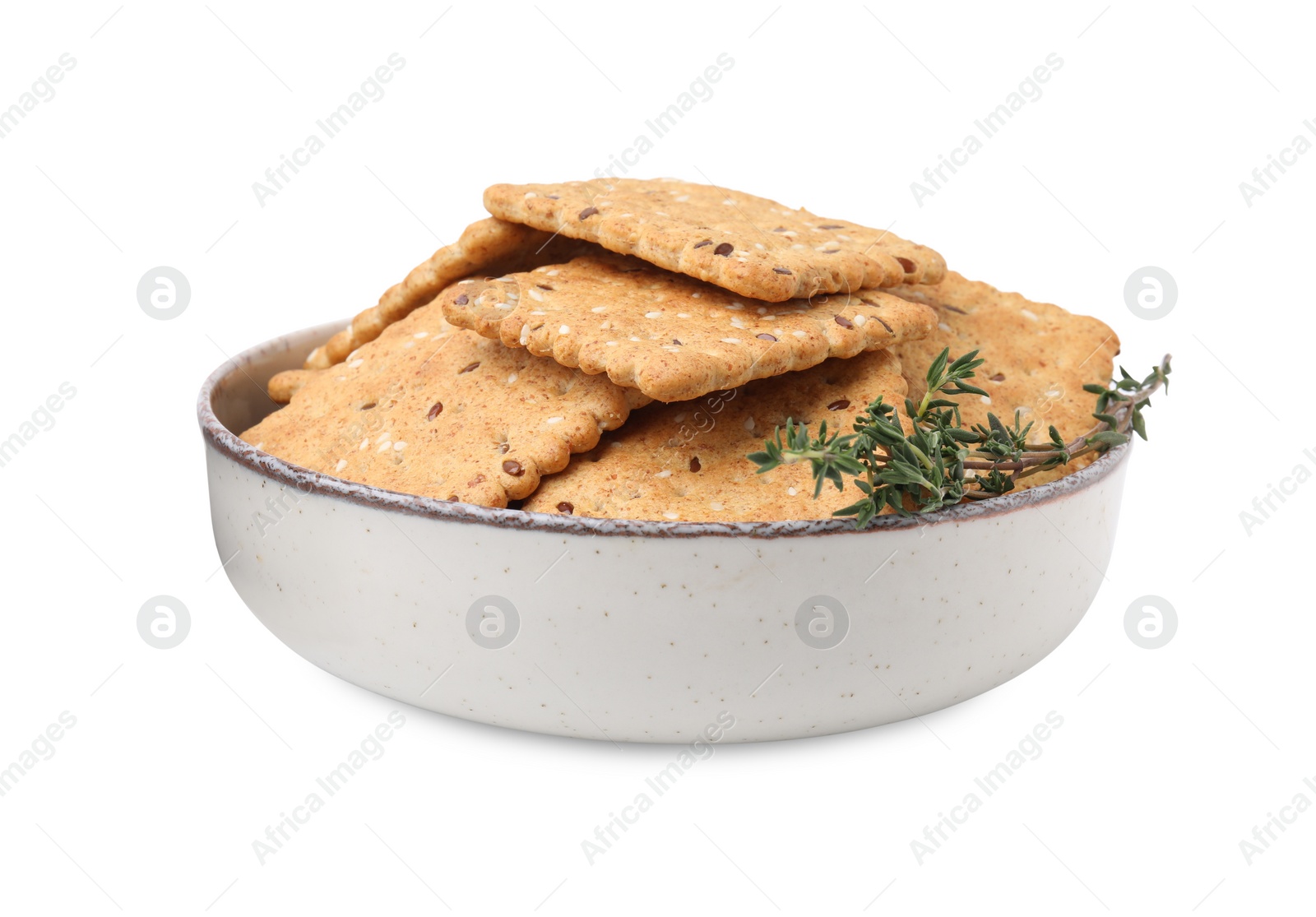 Photo of Cereal crackers with flax, sesame seeds and thyme in bowl isolated on white