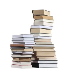 Photo of Stacks of many different books isolated on white