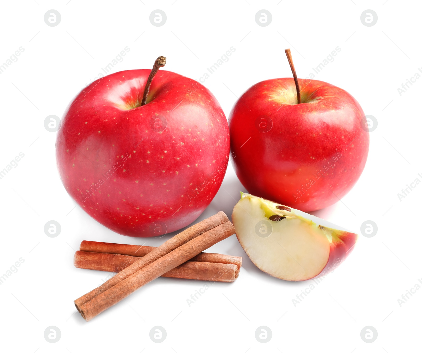 Photo of Fresh apples and cinnamon sticks on white background