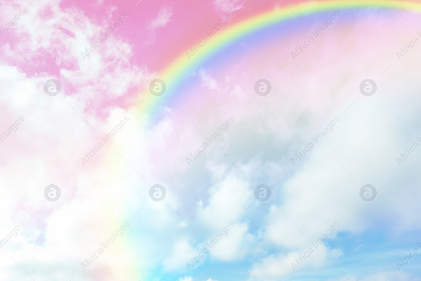 Image of Amazing sky with rainbow and fluffy clouds, toned in unicorn colors