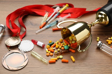 Photo of Composition with drugs on wooden table. Doping control