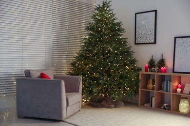 Beautiful Christmas tree with golden lights in living room