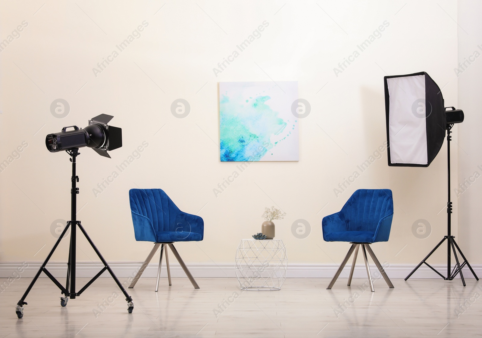 Photo of Professional photo studio equipment prepared for shooting living room interior