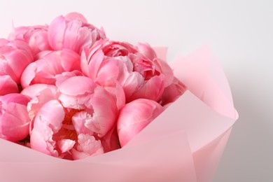 Bouquet of beautiful pink peonies on white background, closeup