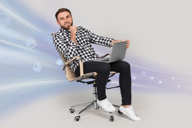 Image of Speed internet. Happy man with laptop sitting in office chair on light grey background. Motion blur effect symbolizing fast connection