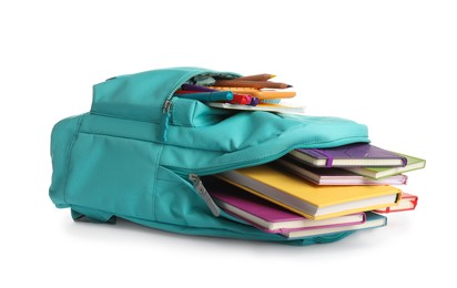 Turquoise backpack with different school supplies isolated on white