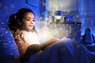 Image of Girl reading shiny magic book with letters flying over it in dark bedroom