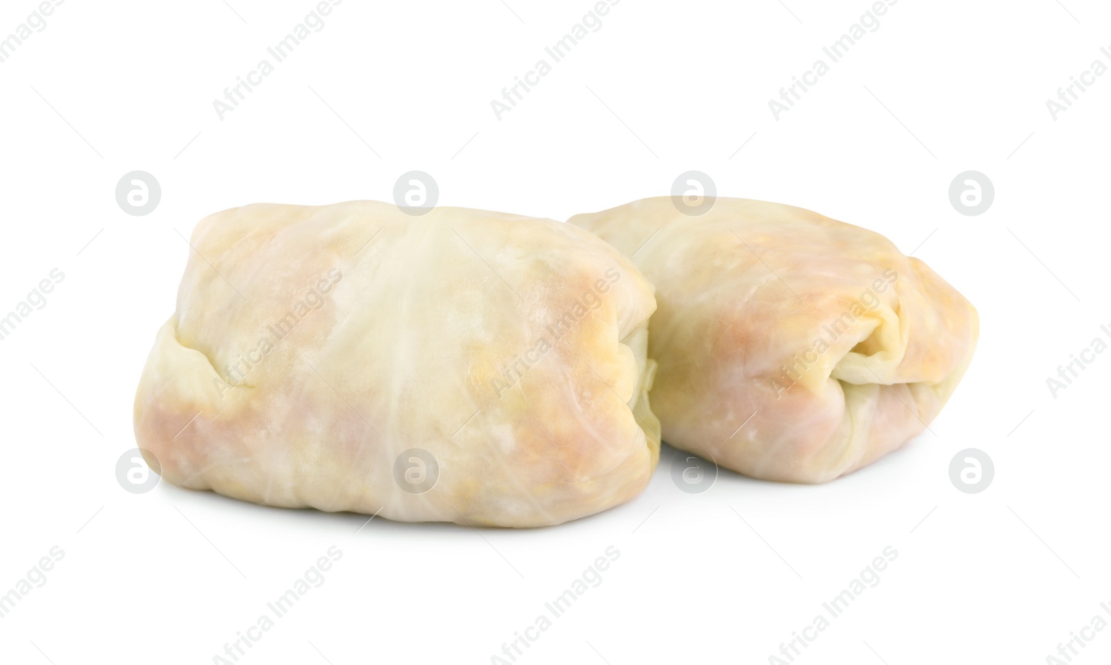 Photo of Uncooked stuffed cabbage rolls on white background