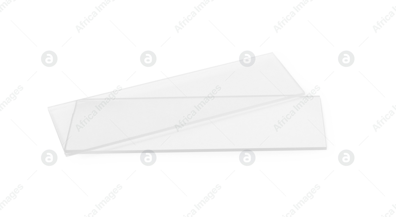 Photo of Clean glass microscope slides on white background