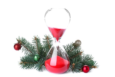 Photo of Hourglass, fir tree twigs and decor on white background. Christmas countdown