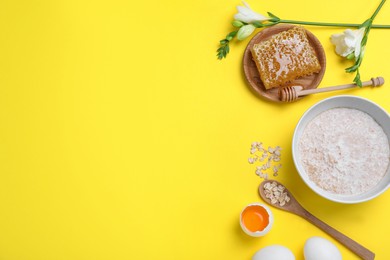 Homemade hair mask and ingredients on yellow background, flat lay. Space for text