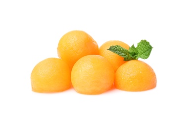Photo of Melon balls with mint on white background