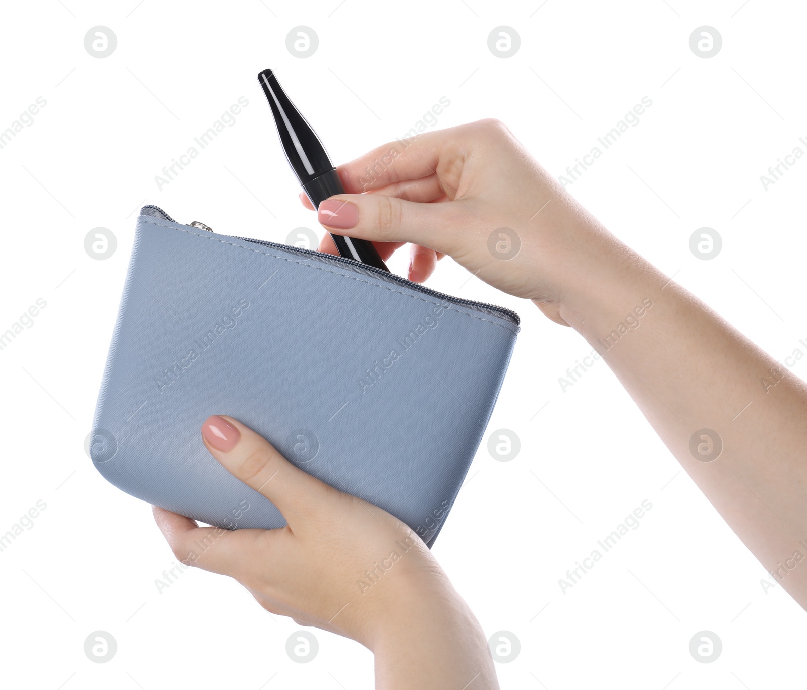 Photo of Woman putting mascara into cosmetic bag on white background, closeup