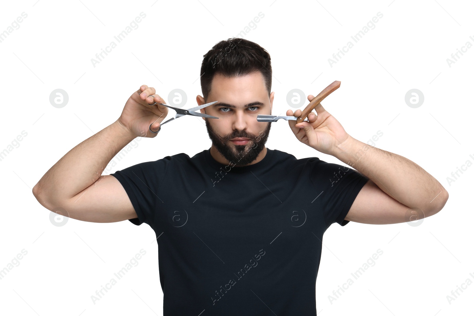 Photo of Handsome young man with mustache holding blade and scissors on white background