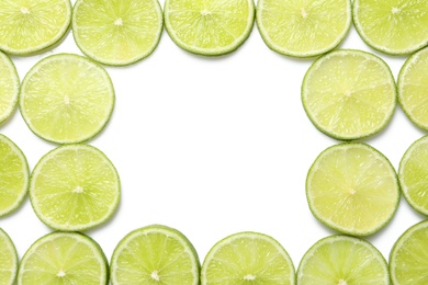 Photo of Fresh sliced ripe limes on white background, top view