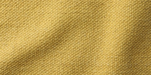 Texture of golden color fabric as background, top view