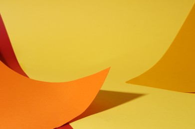 Different colorful paper sheets on yellow background