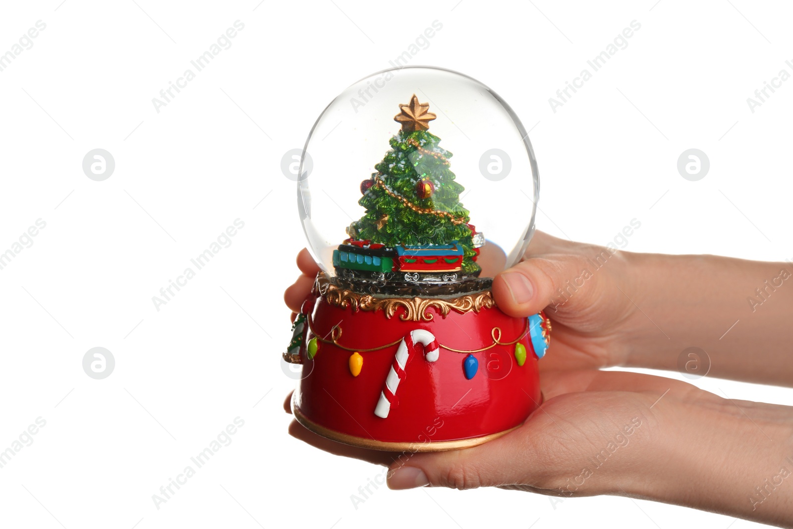 Photo of Woman holding beautiful snow globe on white background, closeup