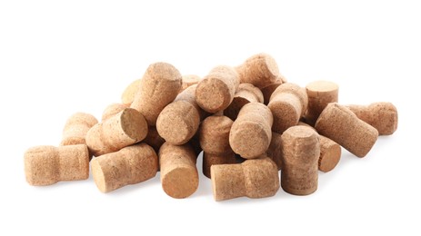 Photo of Heap of sparkling wine corks on white background