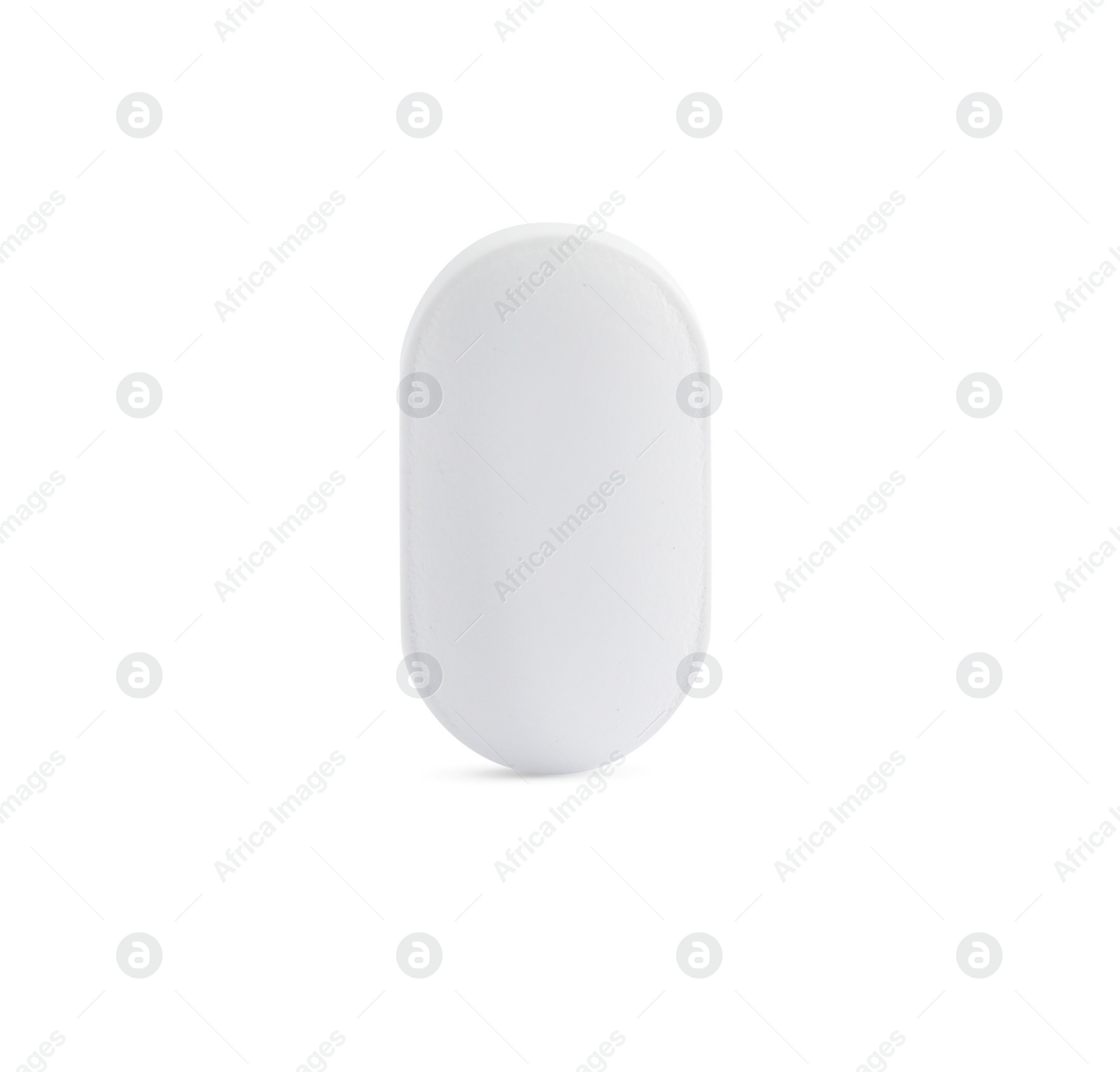 Photo of One pill on white background. Medicinal treatment