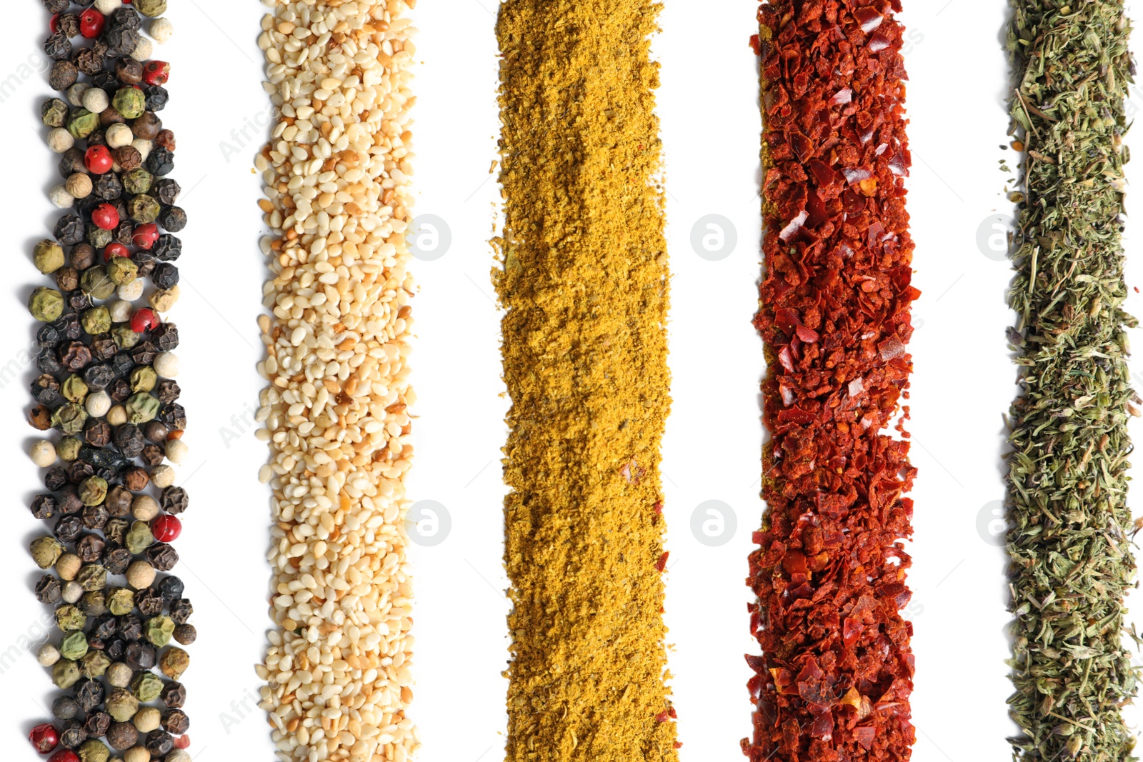 Photo of Rows of different aromatic spices on white background, top view