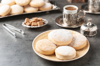 Photo of Composition with traditional Islamic cookies on table, space for text. Eid Mubarak