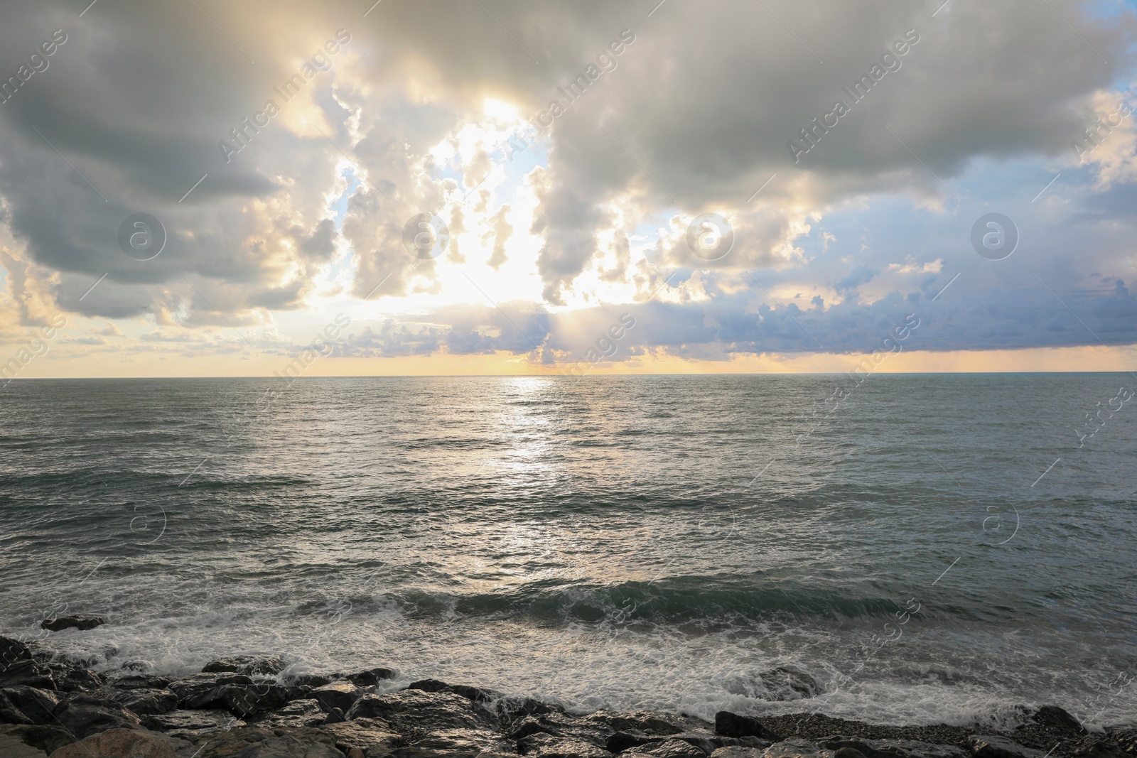 Photo of Picturesque view of sky with heavy rainy clouds over sea