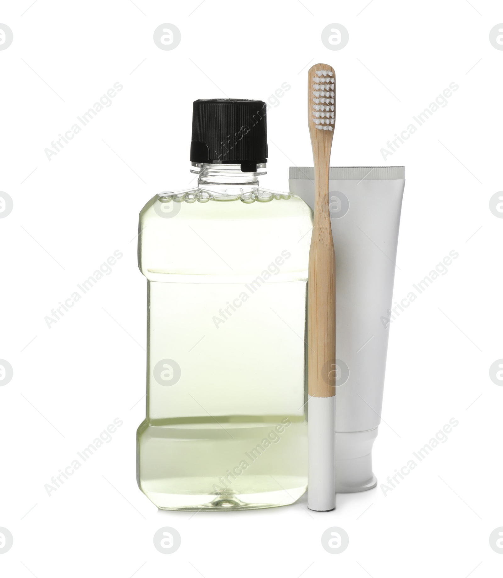 Photo of Mouthwash, toothbrush and paste on white background