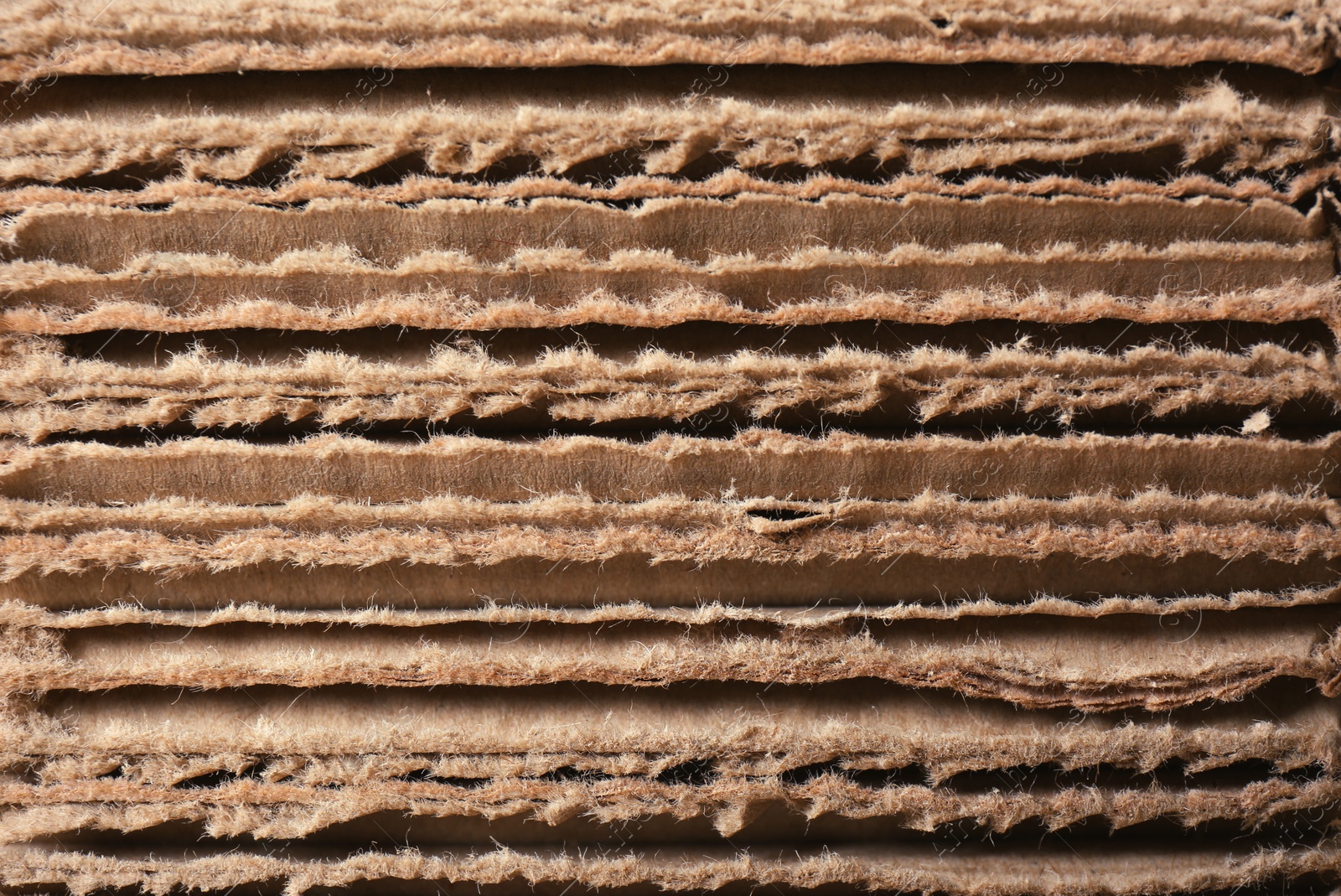 Photo of Closeup view of corrugated cardboard sheets. Recyclable packaging material