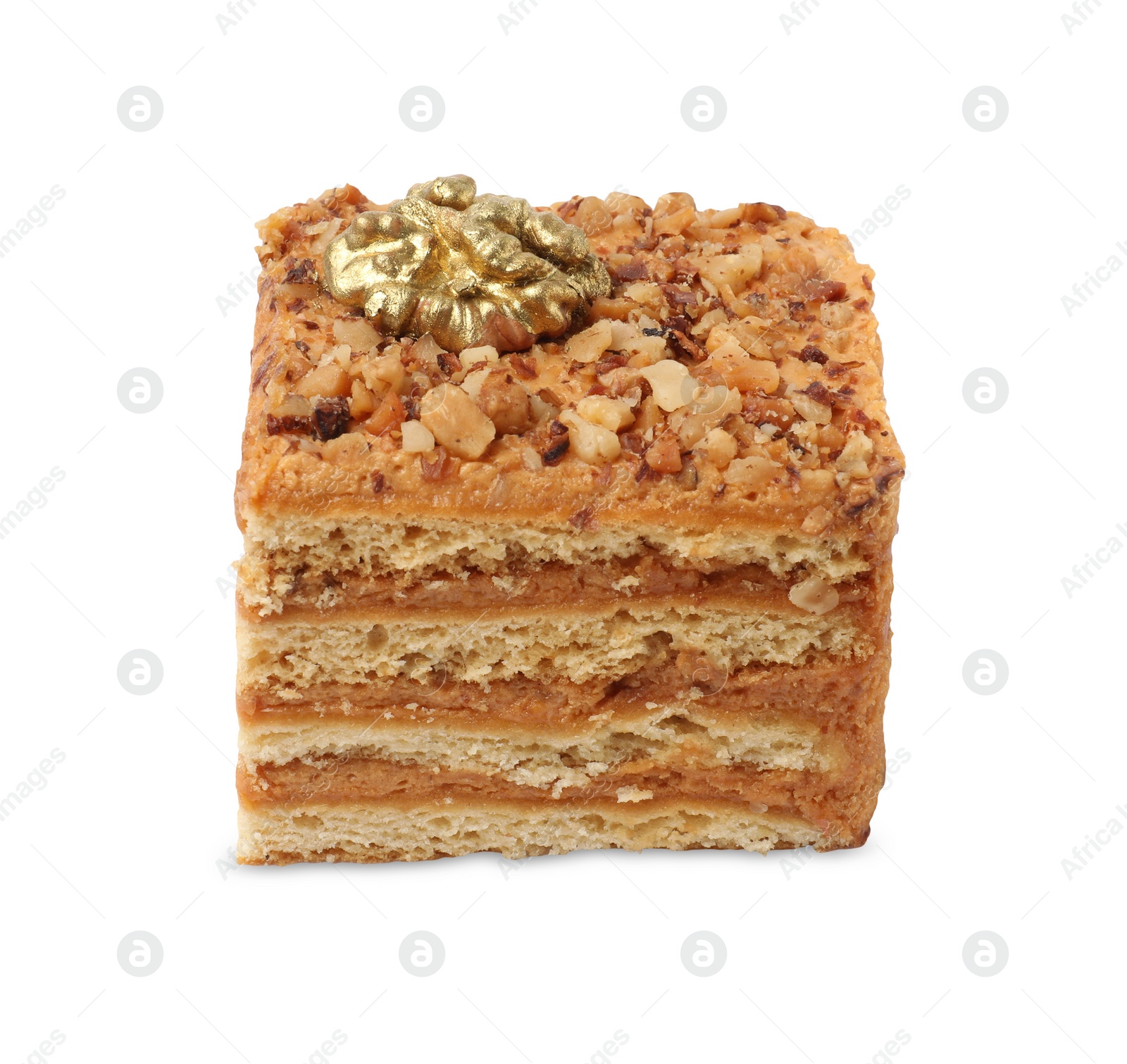 Photo of Piece of layered honey cake with walnuts on white background