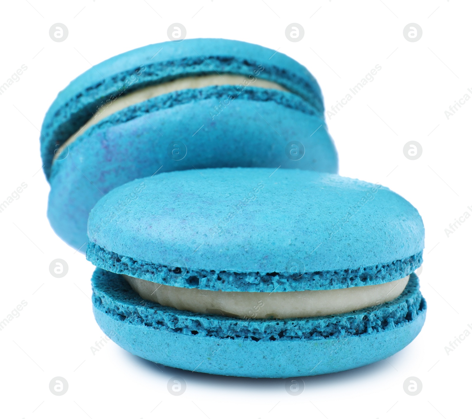 Photo of Light blue macarons on white background. Delicious dessert