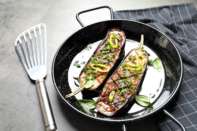 Photo of Frying pan with fried eggplant slices on table