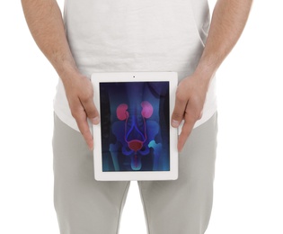 Young man holding tablet with urinary system on screen against white background