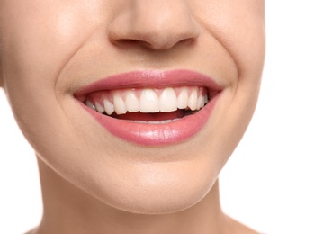 Photo of Young woman with beautiful smile on white background, closeup. Teeth whitening