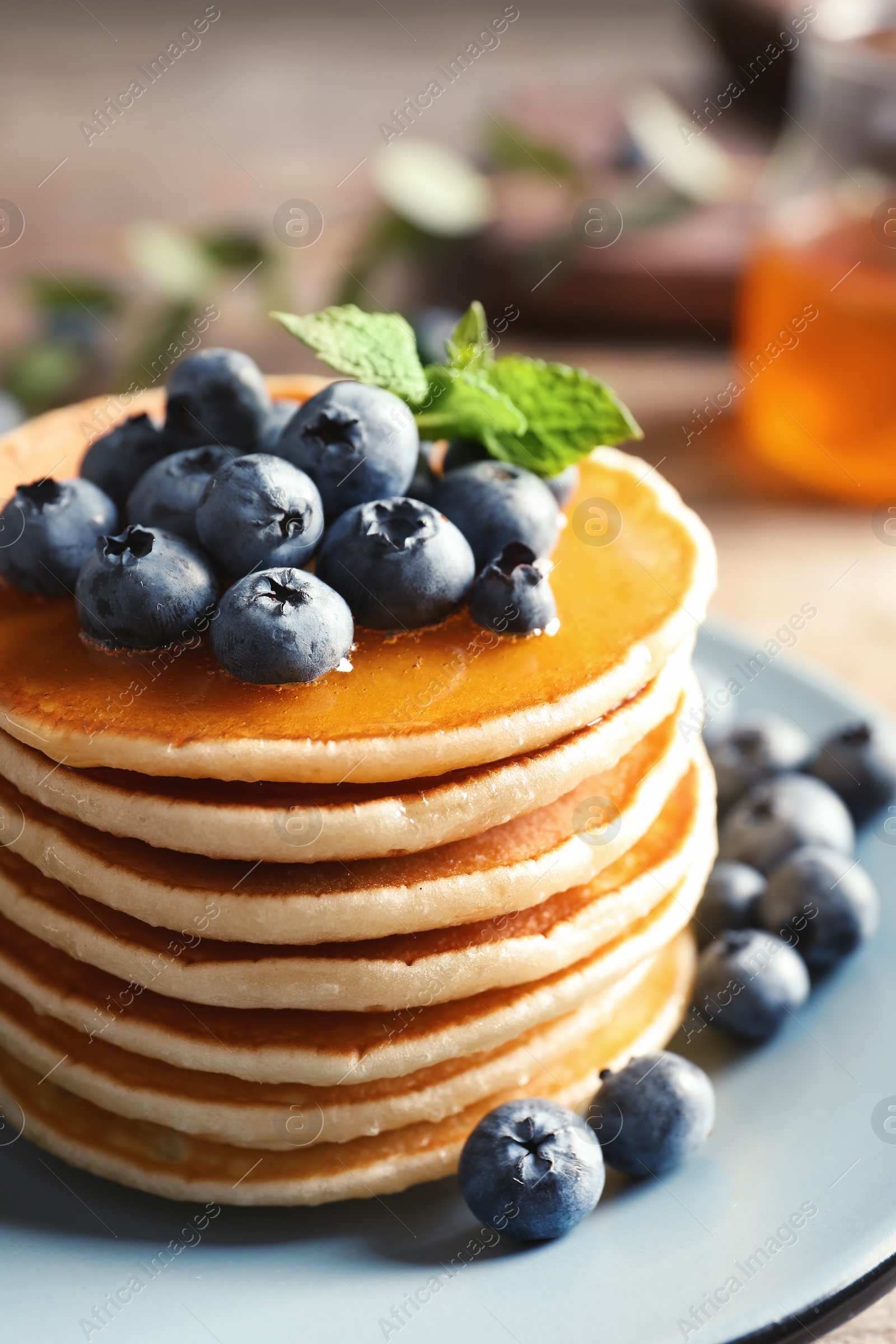 Photo of Plate with pancakes and berries on table, closeup