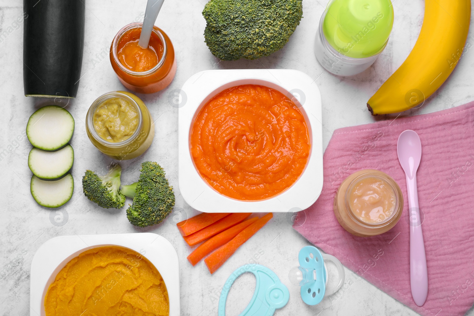 Photo of Flat lay composition with healthy baby food on white textured table