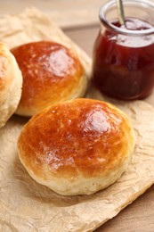 Tasty scones prepared on soda water and jam on wooden table