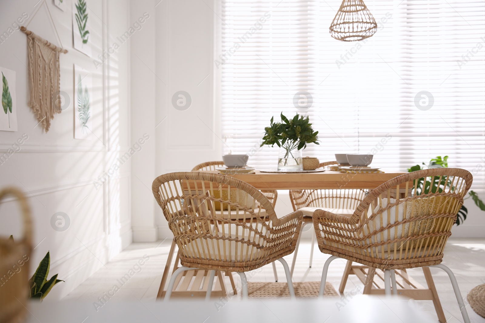 Photo of Stylish wooden dining table and chairs in room. Interior design