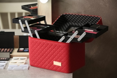 Case with makeup products on dressing table