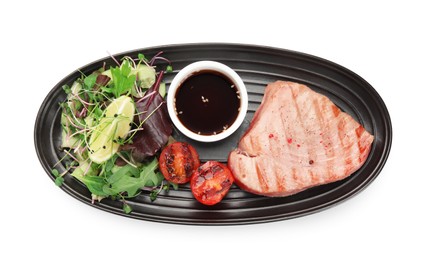Photo of Delicious tuna steak, salad, tomato and sauce on white background, top view