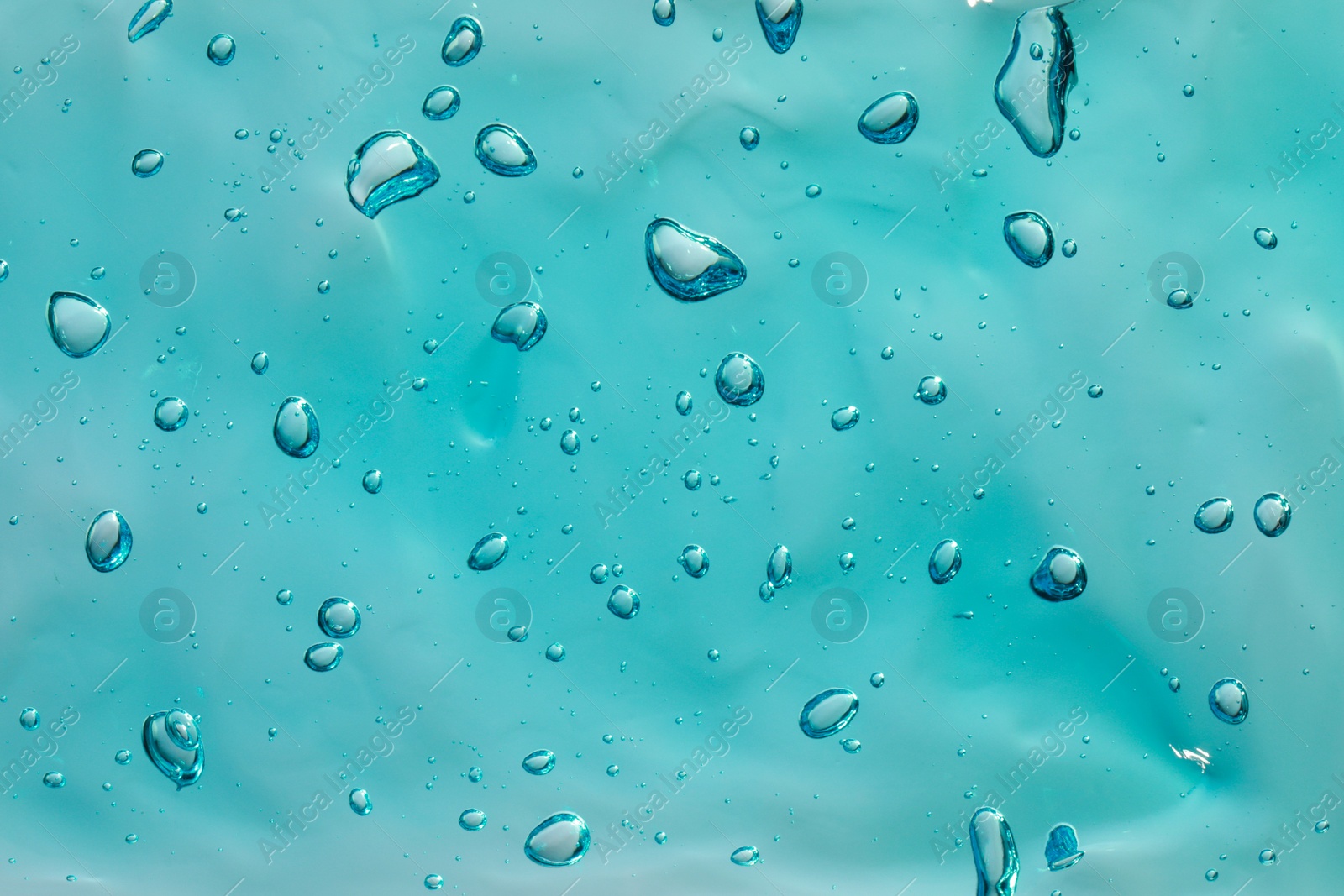 Photo of Turquoise facial gel as background, closeup view