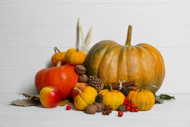 Happy Thanksgiving day. Beautiful composition with pumpkins on white wooden table