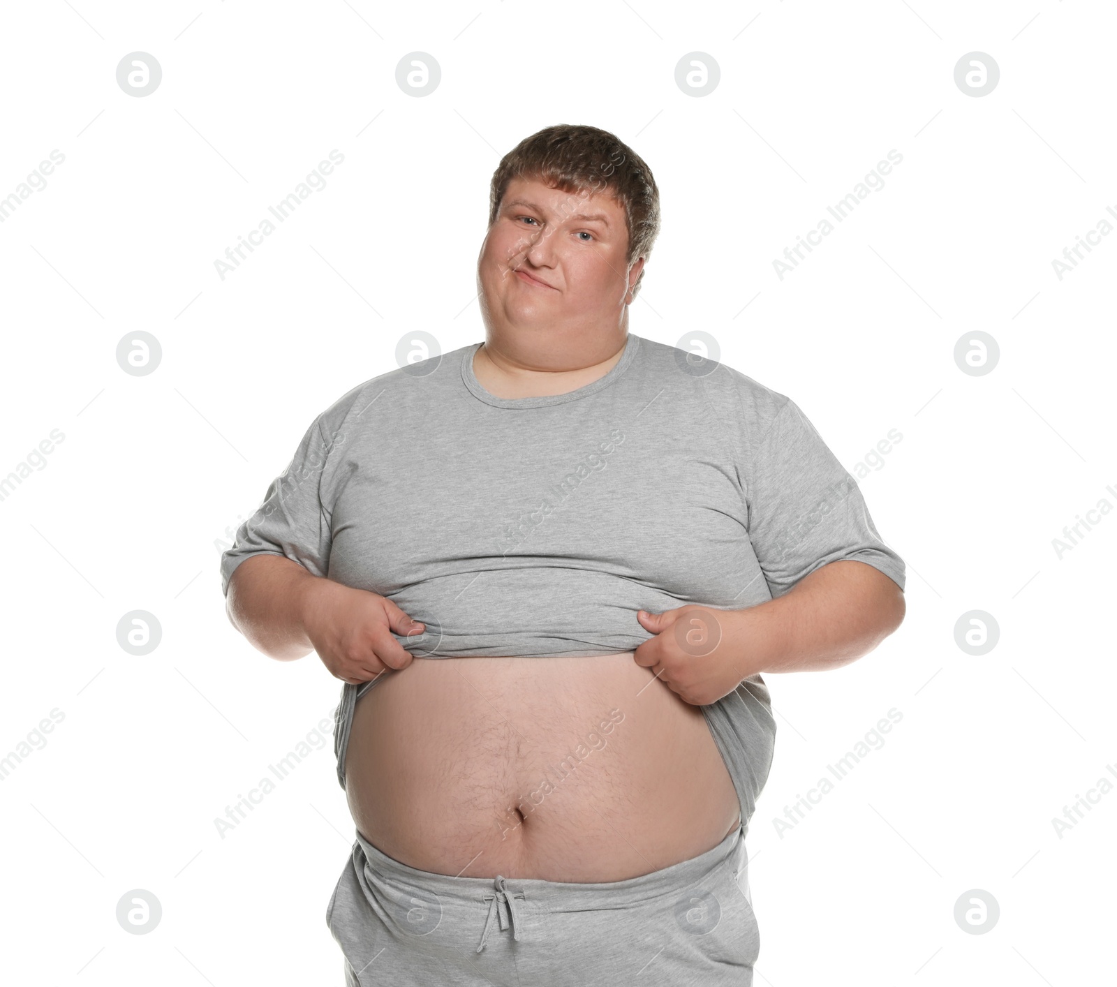 Photo of Emotional overweight man posing on white background