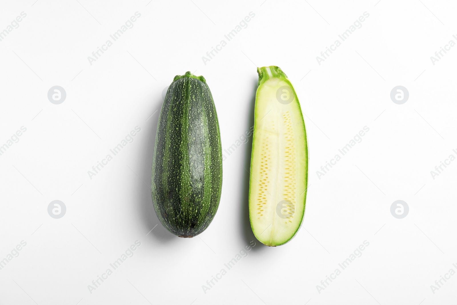 Photo of Fresh ripe green zucchinis on white background, top view