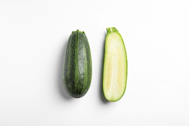 Photo of Fresh ripe green zucchinis on white background, top view